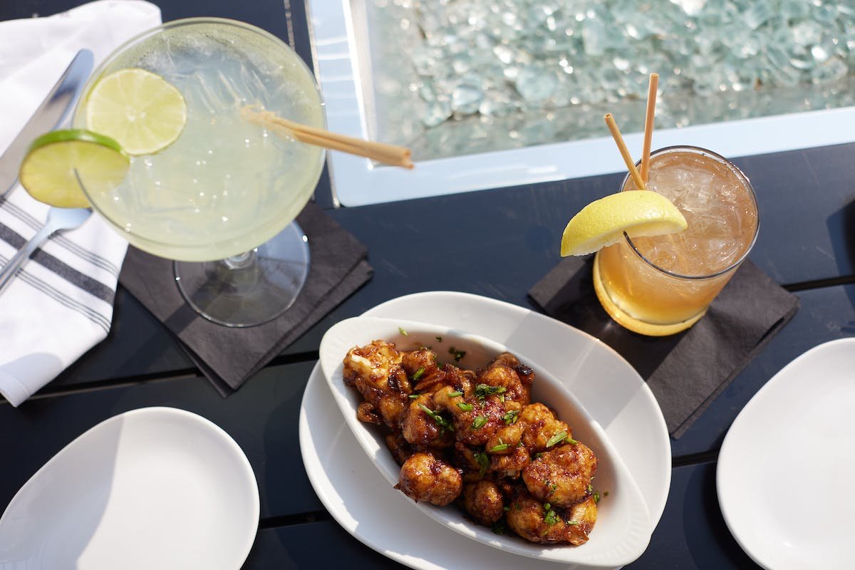 a bowl of food on a plate on a table